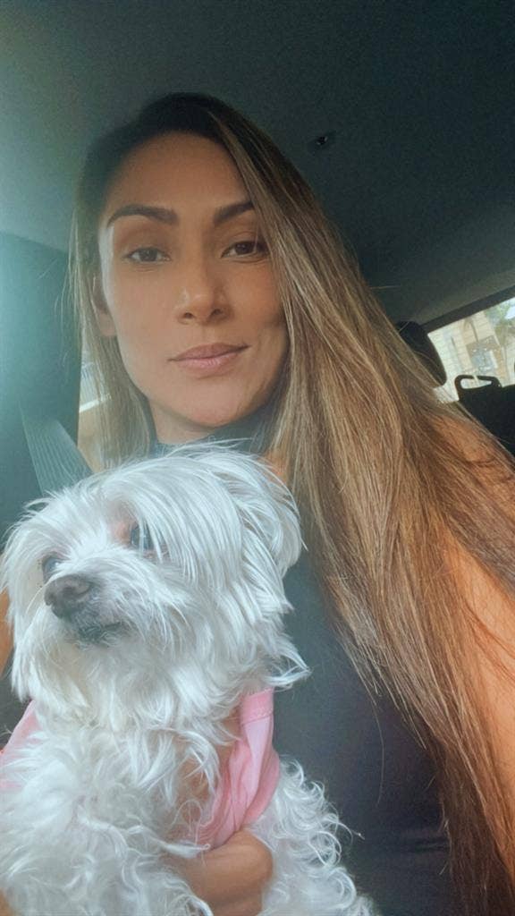 Responsible female with small dogg