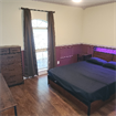 Furnished bedroom with utilities