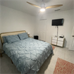 Furnished bedroom with private bath