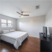 Nice clean bedroom with tv and bed